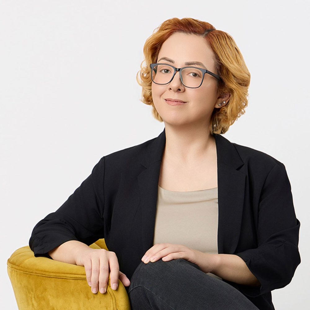 Stephanie Munson, founder and president of Women in Business Connections (WIBC), wearing a black blazer and glasses.